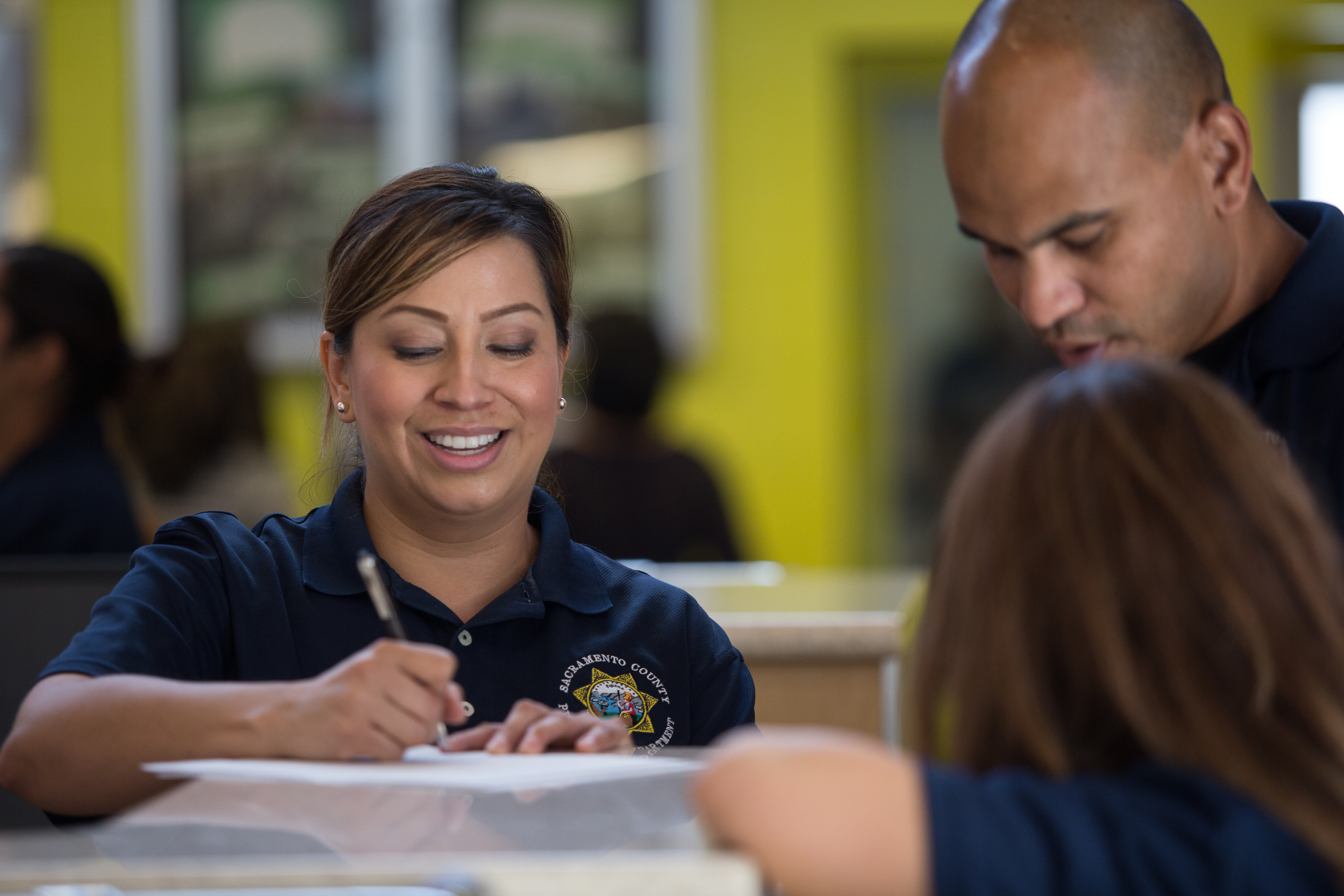 Recruitment officer signing a paper